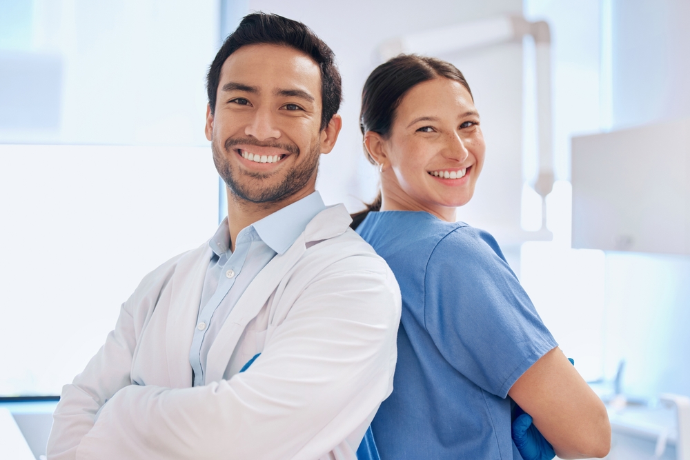 portrait,,dentist,team,and,arms,crossed,in,clinic,for,orthodontics,