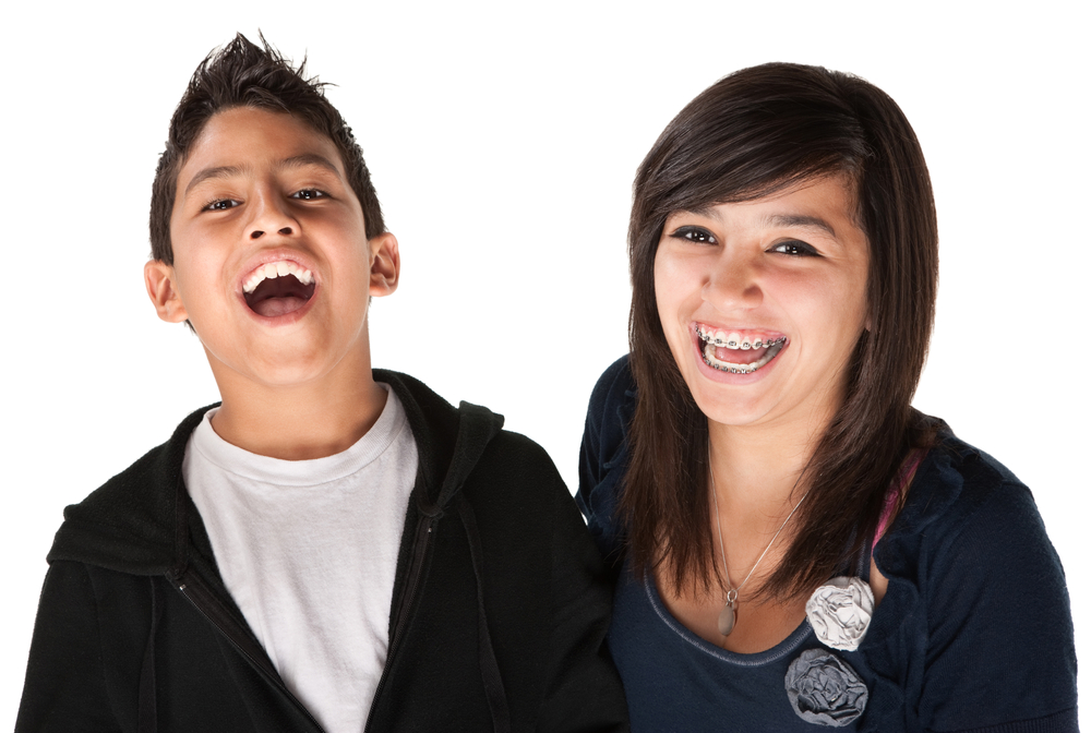 two,hispanic,kids,laughing,on,white,background