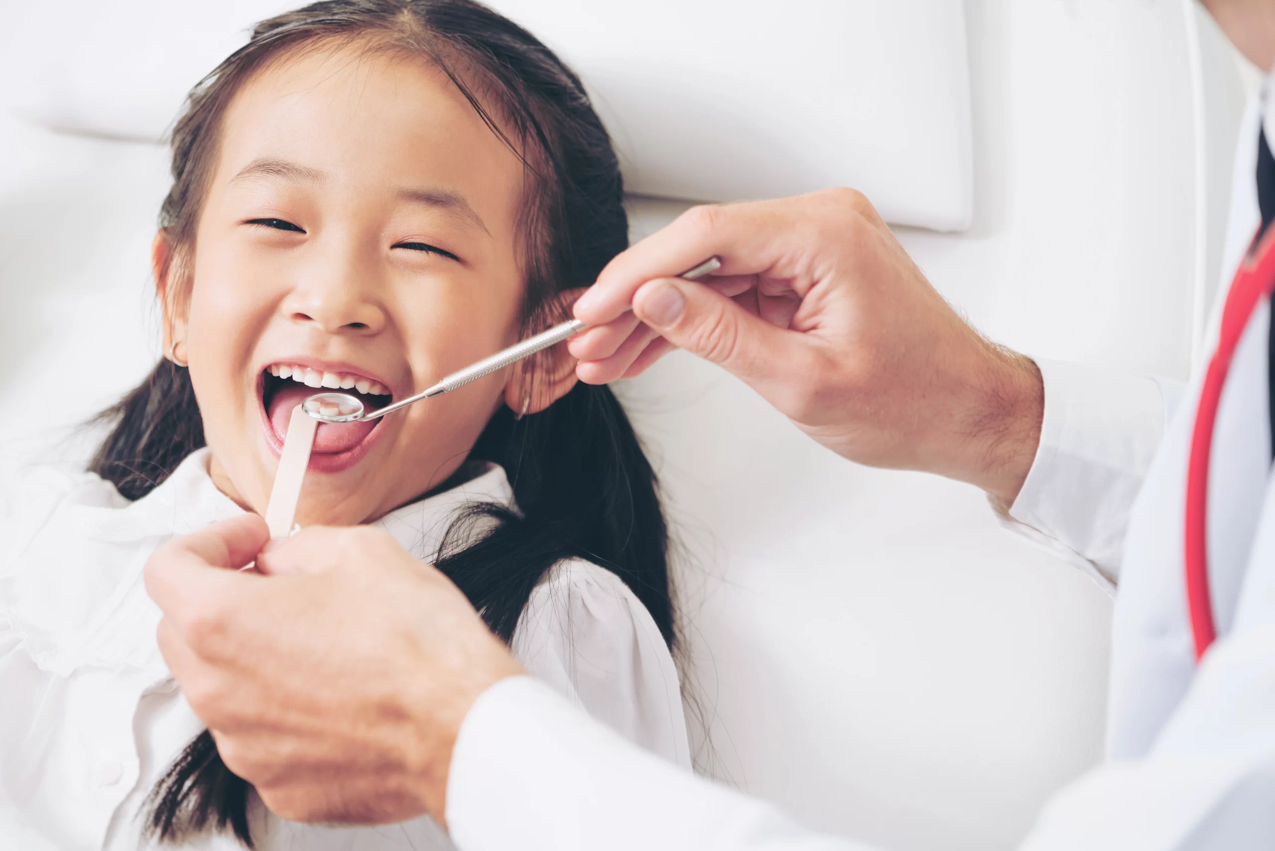 Smiling child at a dental checkup using Nitrous Oxide For Kids