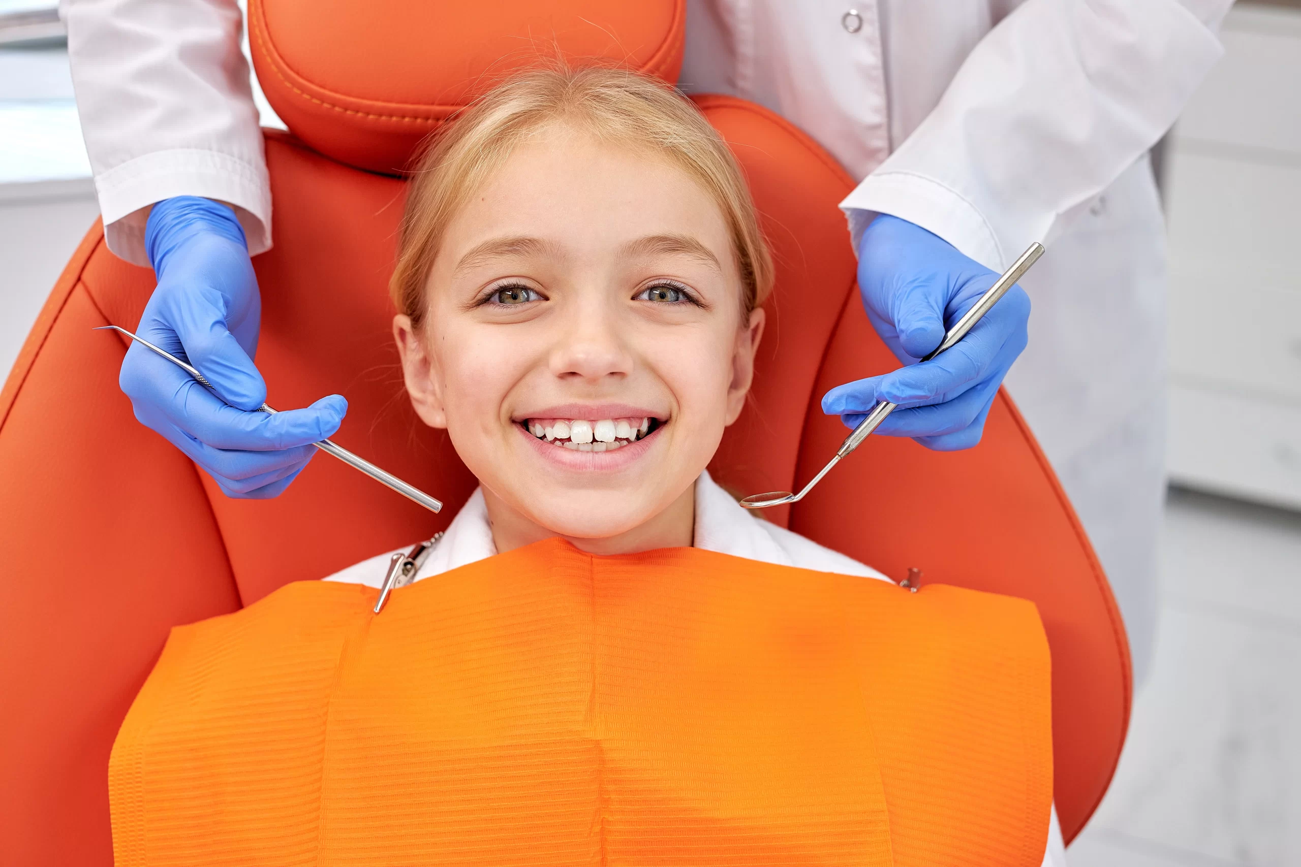 Smiling child at a dental cleaning for kids check-up