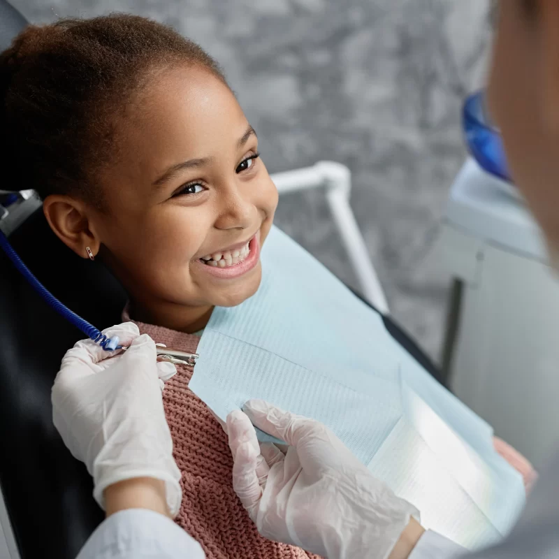 Child smiling at dentist appointment