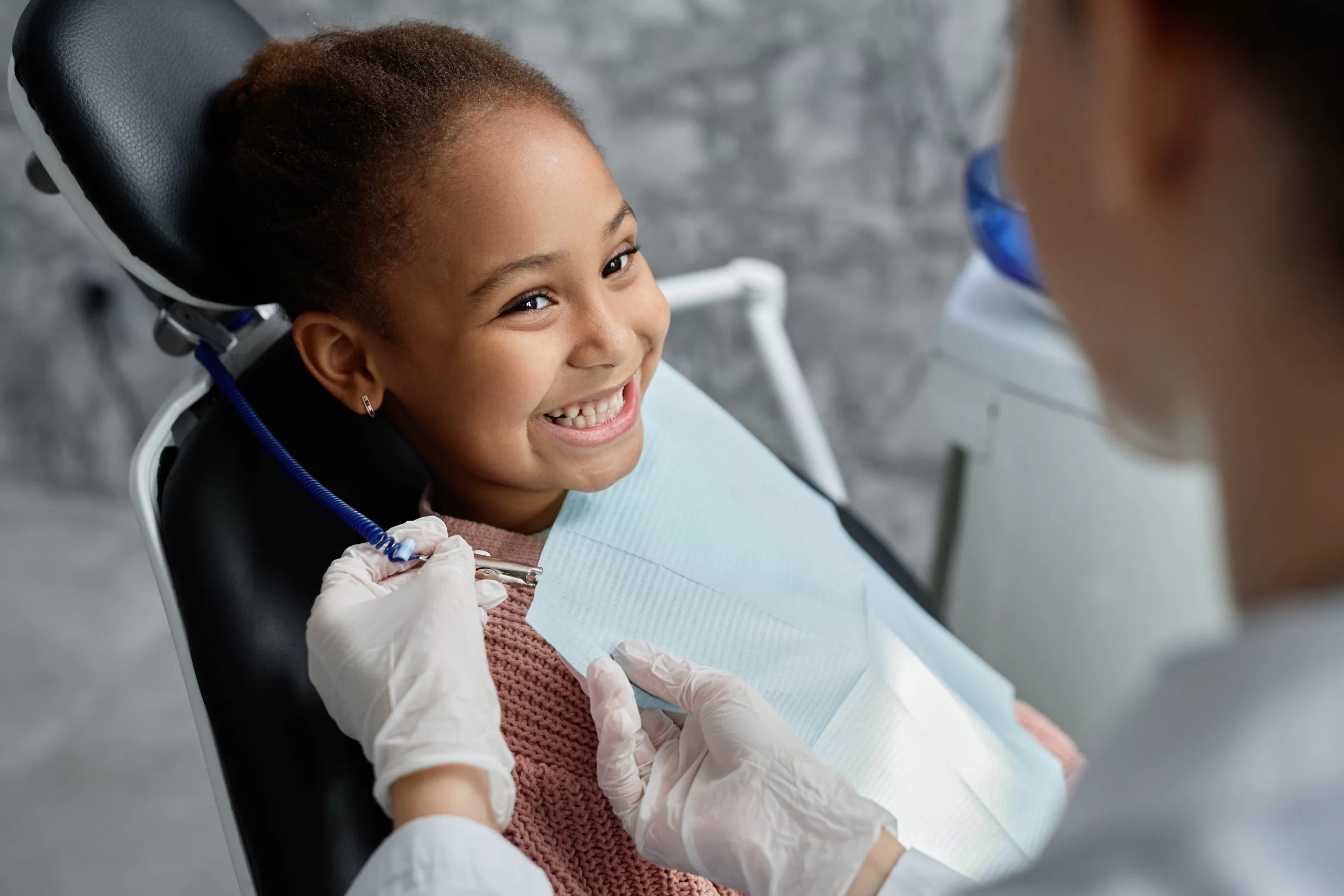 Child smiling at dentist appointment