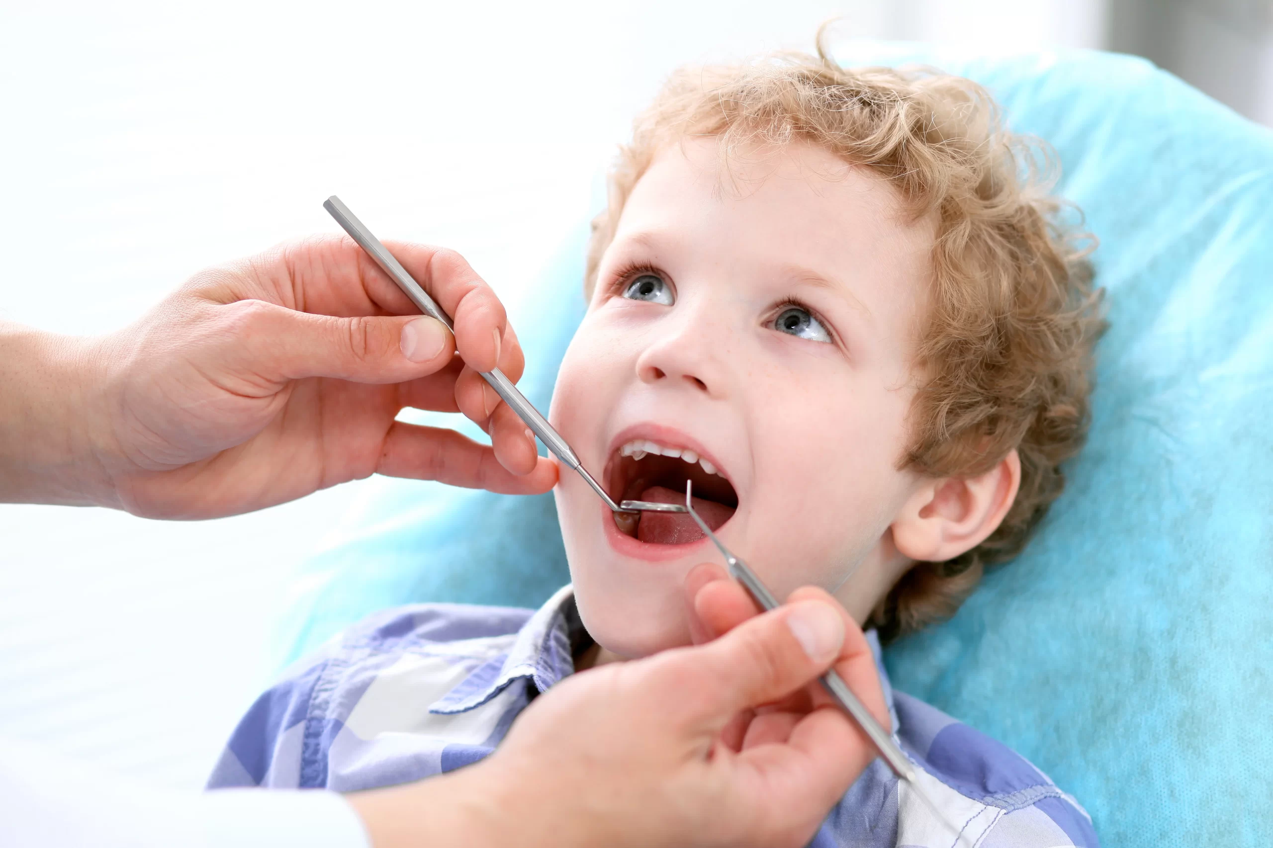 Child having dental checkup with dentist using Nitrous Oxide For Kids