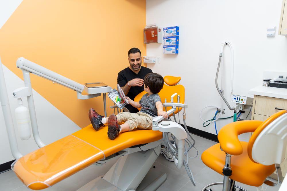 Dentist with child in dental office